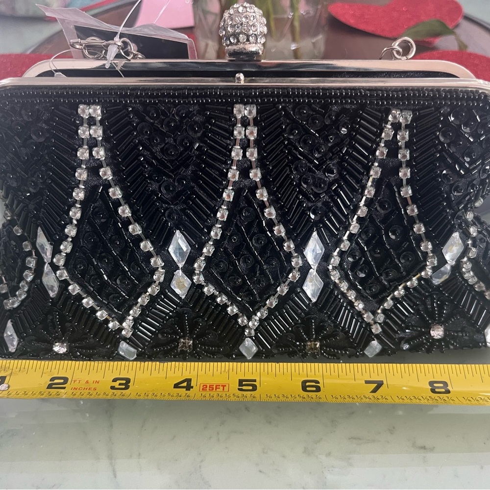 Elegant 9” d’marteaux Black Beaded Clutch has never been used. It still has tags